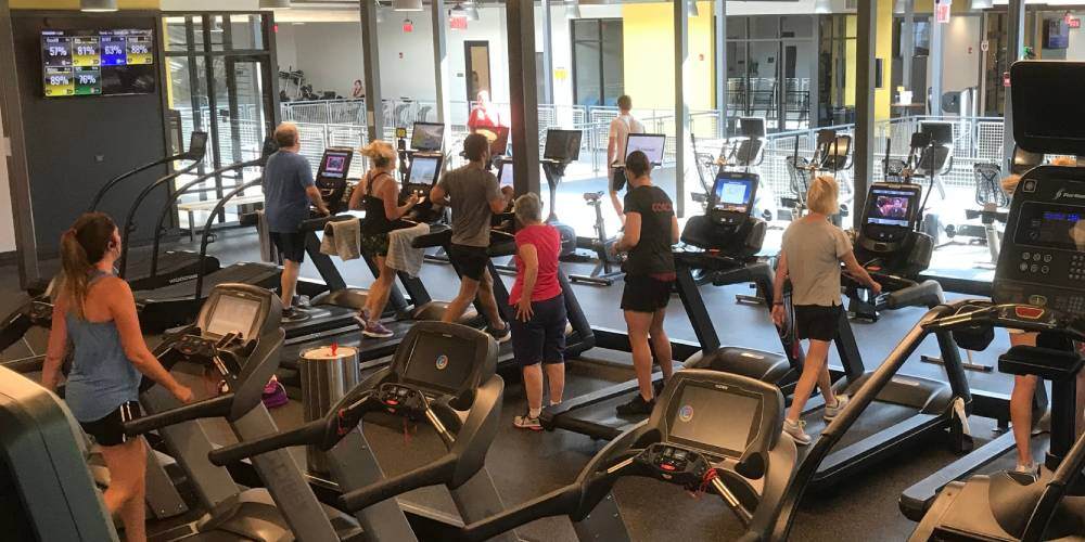 Gym members on cardio equiment in the gym at Cedardale Athletic Club