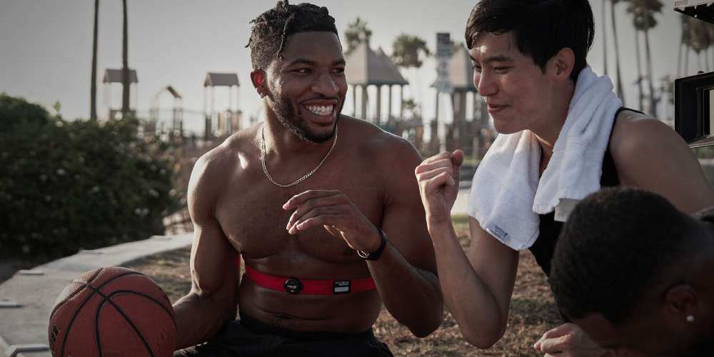 Two basketball players measuring their heart rate with Myzone