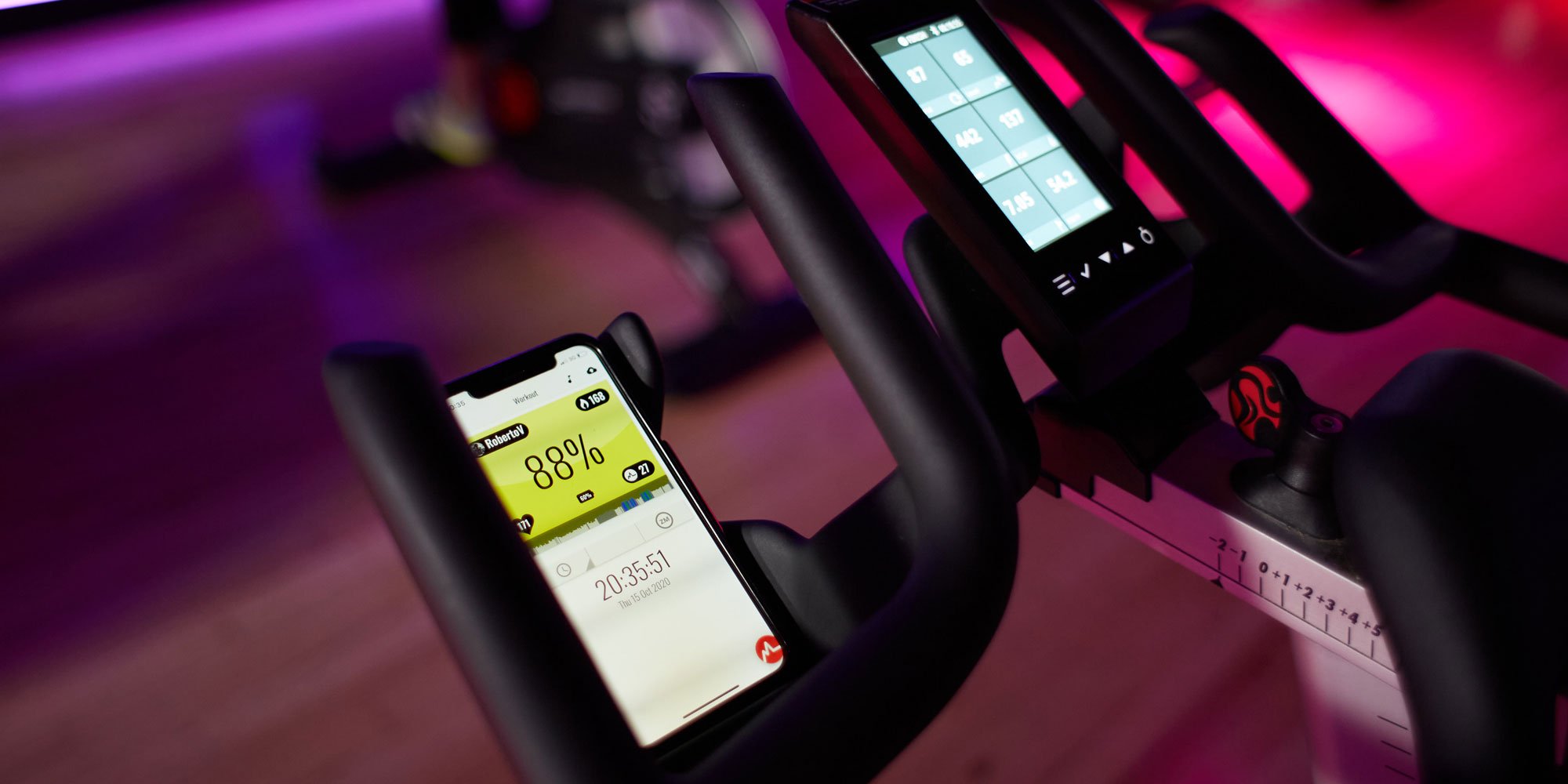 Smartphone with Myzone app on a bike